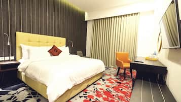 Draps en coton égyptien, minibar, coffres-forts dans les chambres