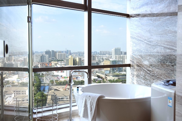 Separate tub and shower, designer toiletries, hair dryer, bathrobes