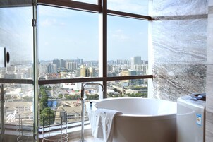 Separate tub and shower, designer toiletries, hair dryer, bathrobes