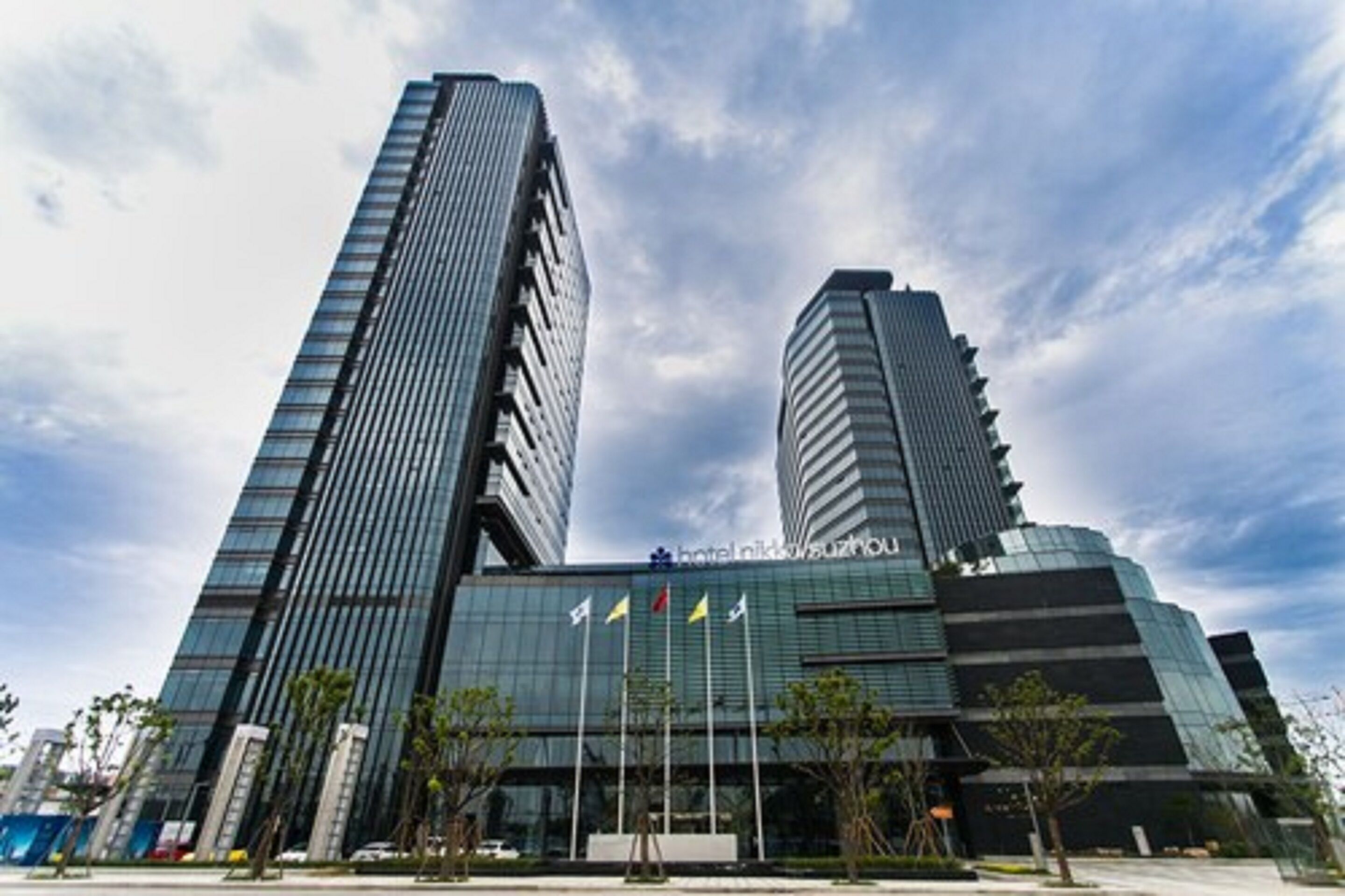A modern hotel building with two prominent skyscrapers.