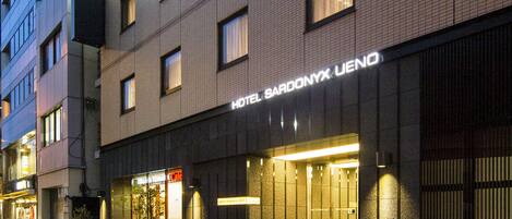 A modern hotel building with a sign reading "HOTEL SARDONYX UENO".