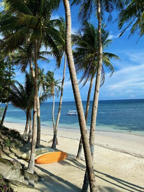 On the beach, sun-loungers