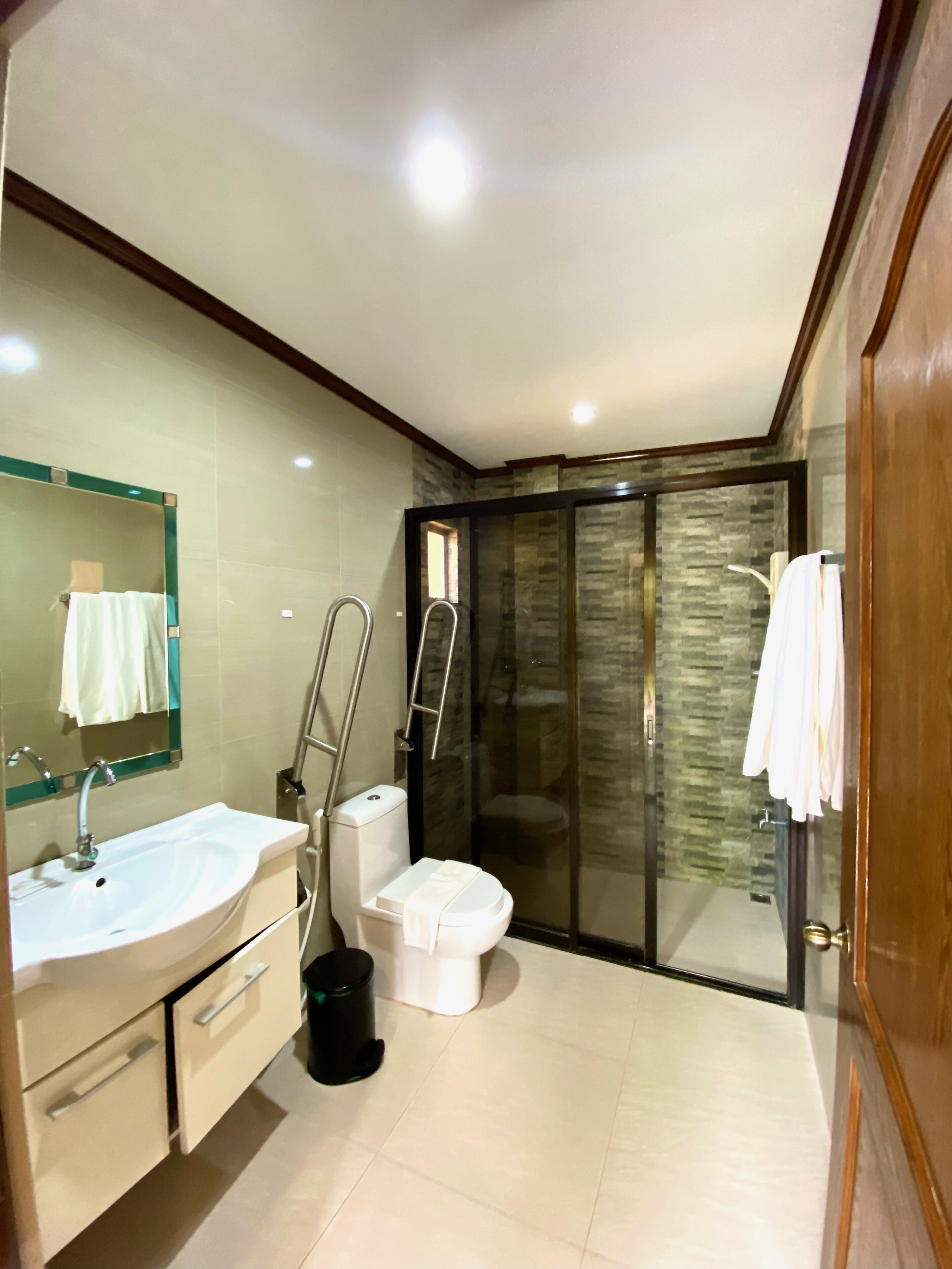 deluxe family room | bathroom | shower, rainfall showerhead, free toiletries, hair dryer