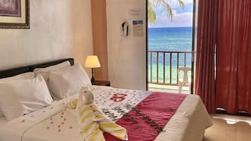 Deluxe Beachfront Room | Minibar, in-room safe, desk, free WiFi