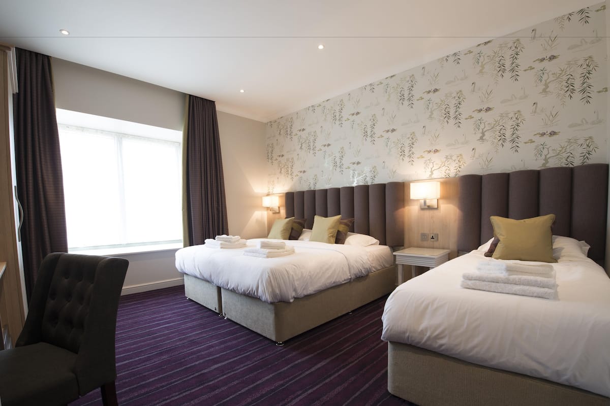 family triple room, 1 bedroom | individually decorated, desk, laptop workspace, iron/ironing board