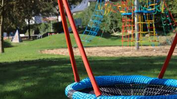 Enjoy a fun-filled day at this playground with a swing set and climbing structure.