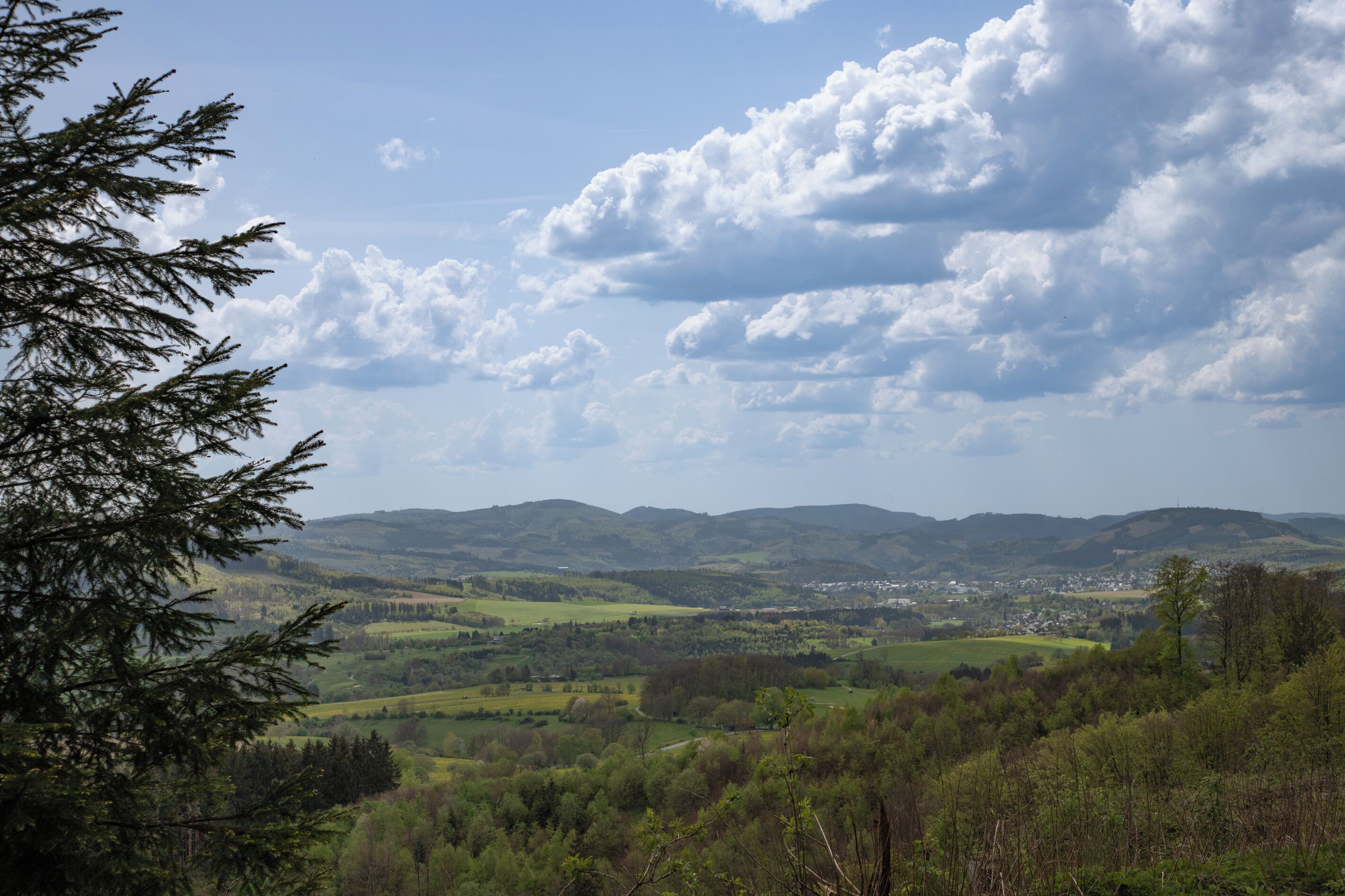 A mountainous landscape with a town in the valley.