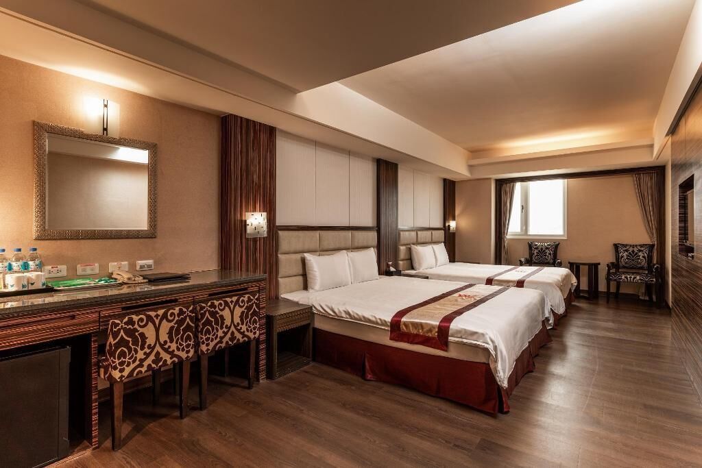Premium bedding, desk, laptop workspace, blackout drapes
