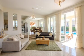 Signature Villa (Anastel 2) | Living room | 43-inch flat-screen TV with digital channels, TV - Artisan Homes (Paralimni)