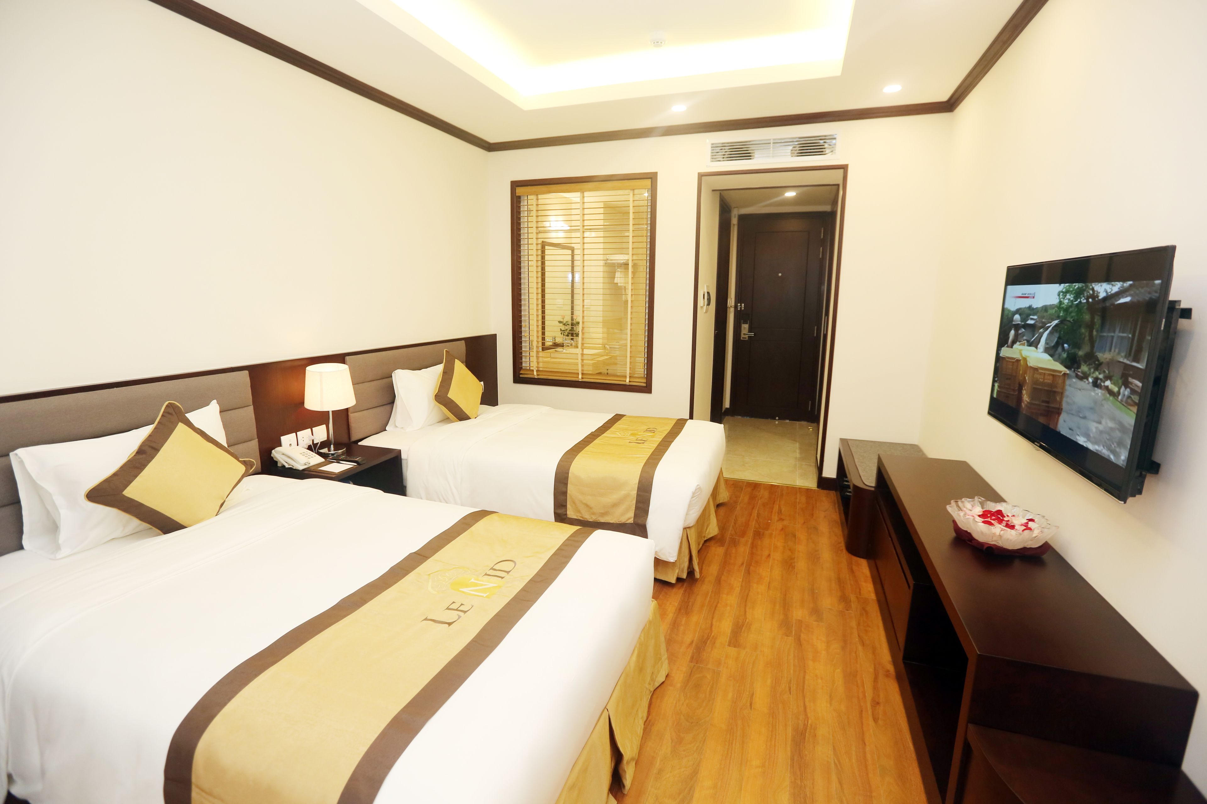 executive twin with internal view | minibar, in-room safe, desk, laptop workspace