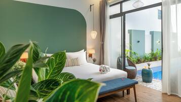Suite, 1 King Bed, Pool View | Minibar, in-room safe, individually decorated, individually furnished