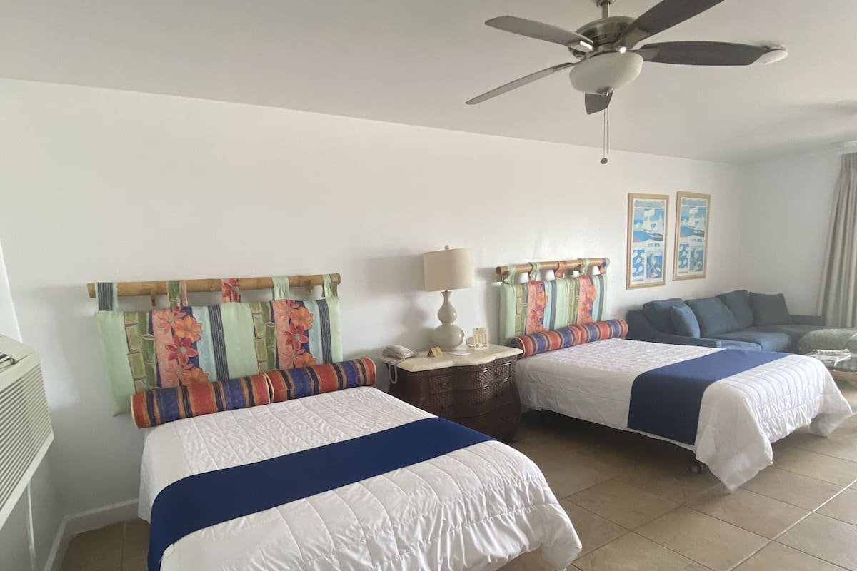 Double Room, Partial Ocean View | Desk, iron/ironing board, free WiFi, bed sheets