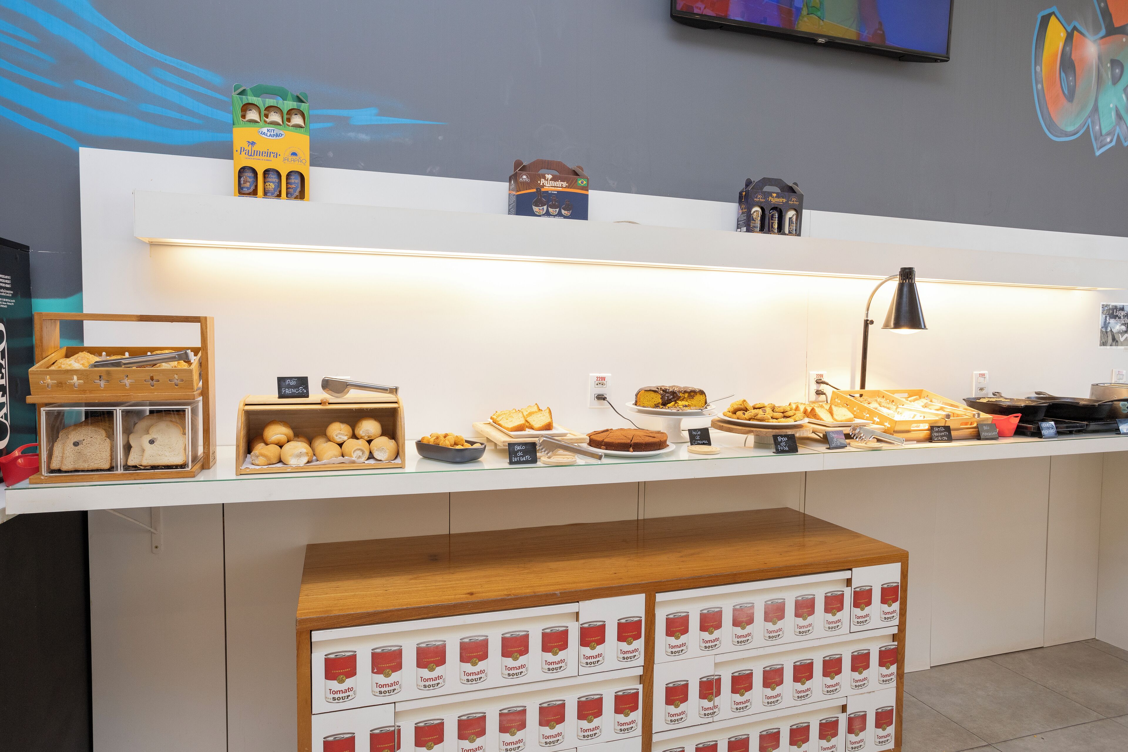 A breakfast buffet with various food items and condiments.