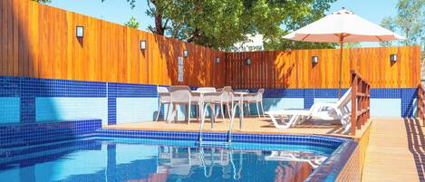 Outdoor pool, open 8:00 AM to 10:00 AM, pool umbrellas, pool loungers