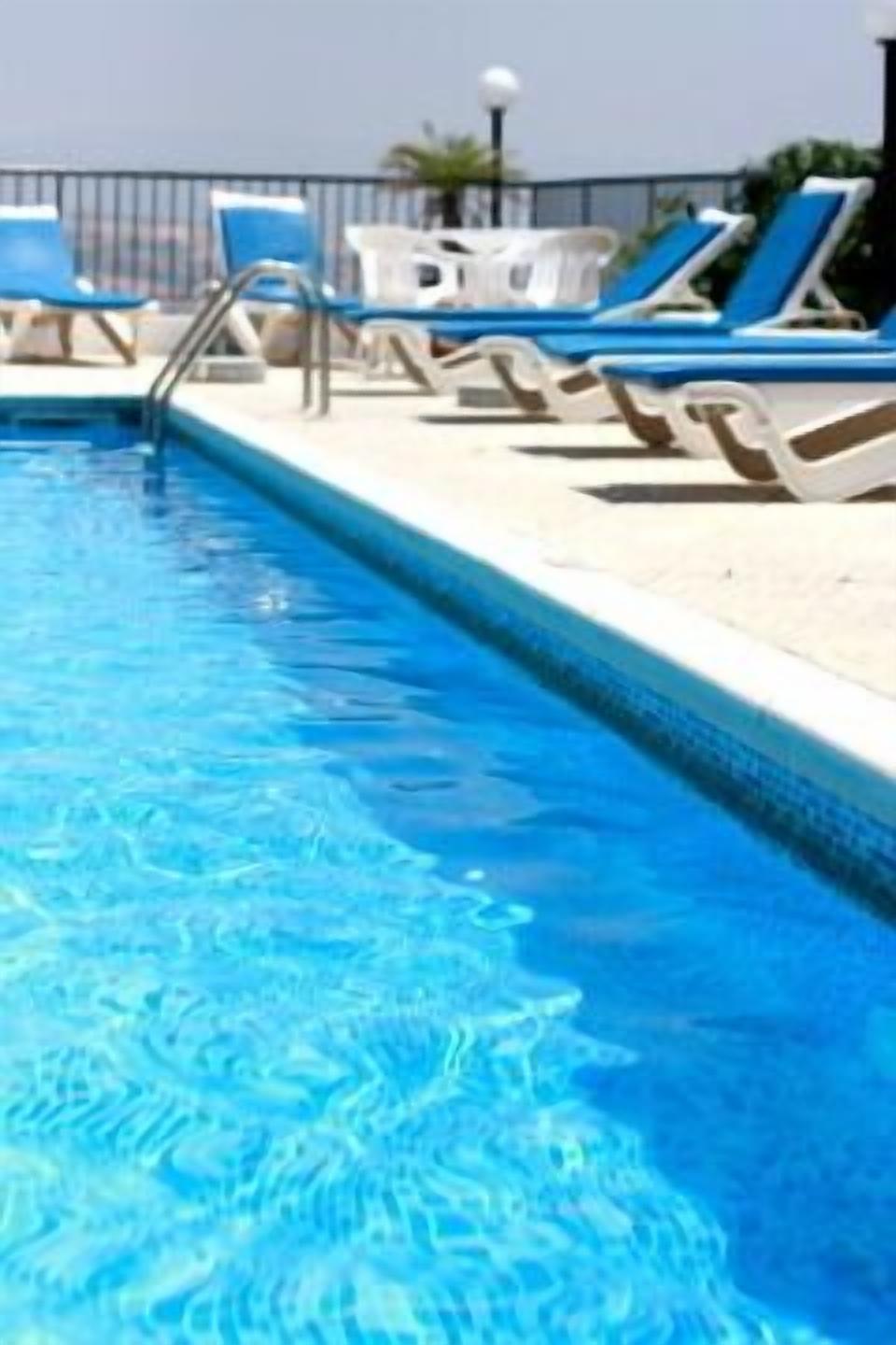 Outdoor pool, pool umbrellas, sun loungers