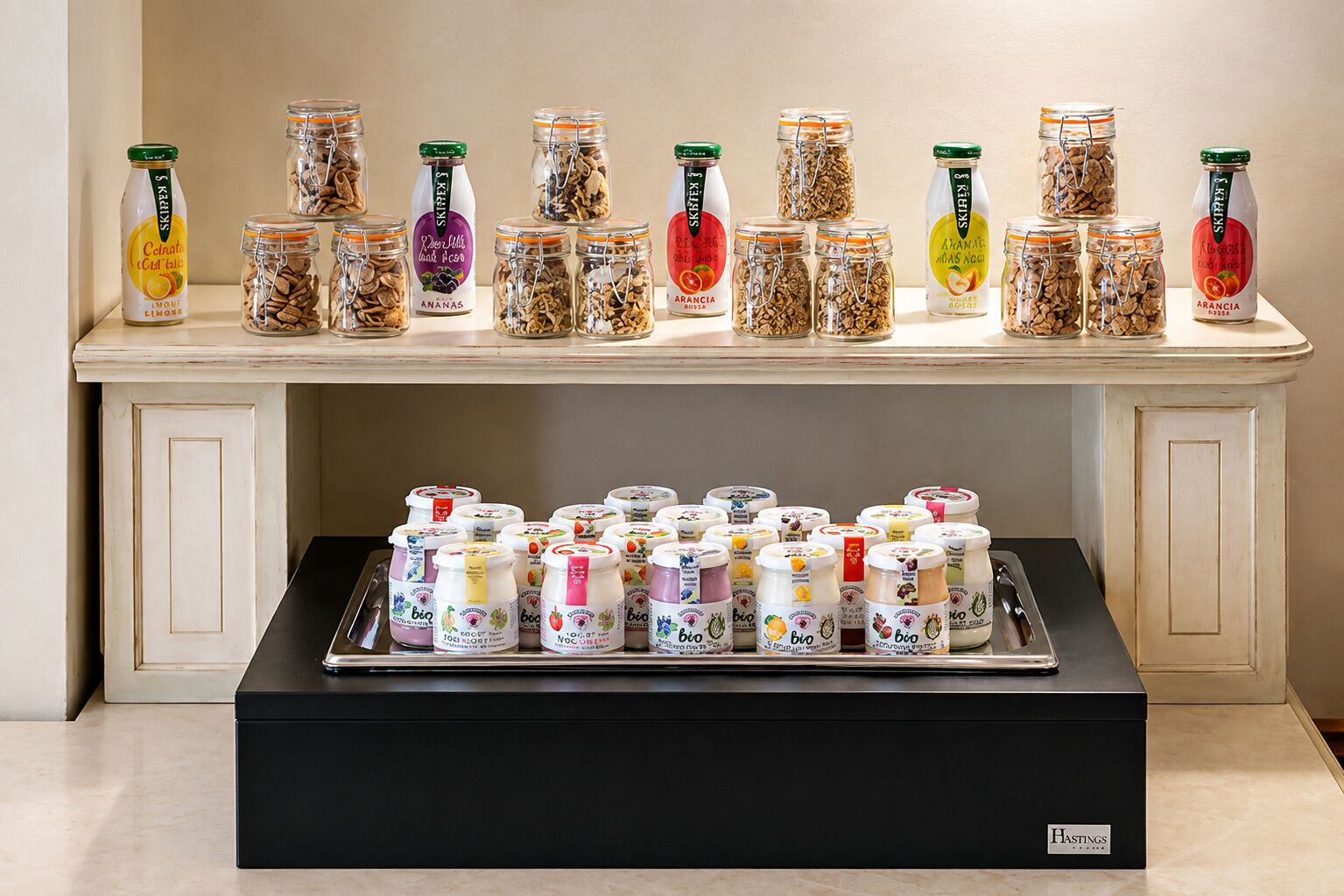 A display of jars and containers with various labels, arranged on a shelf and a table.
