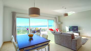Deluxe Townhome, 2 Bedrooms, Sea View, Sea Facing | Living area | 32-inch flat-screen TV with cable channels, TV