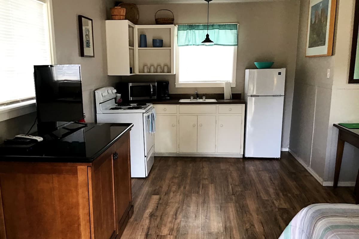 Microwave, coffee/tea maker, dining tables