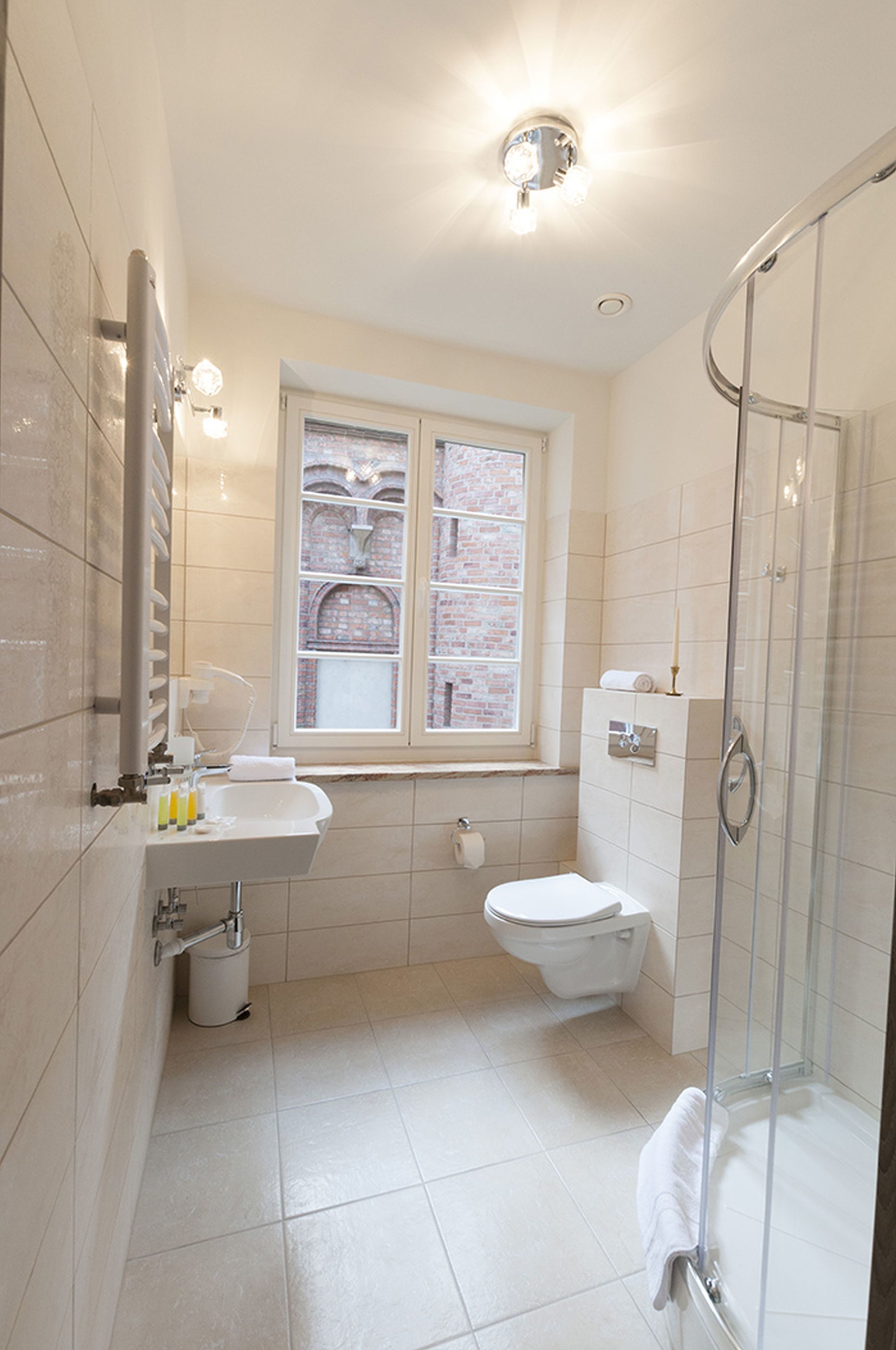 standard quadruple room | bathroom | shower, free toiletries, hair dryer, slippers