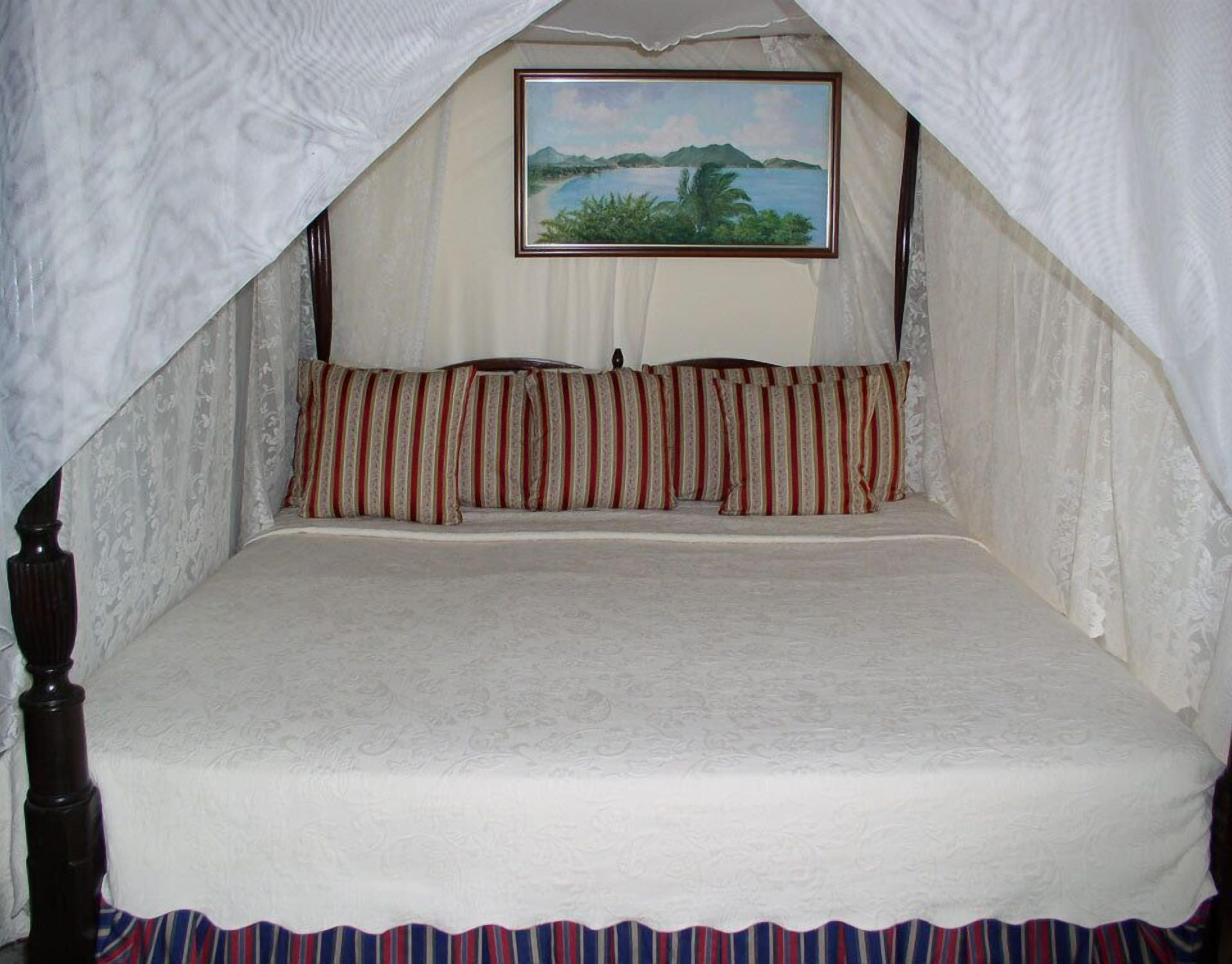 deluxe room, beachfront | premium bedding, in-room safe, individually decorated