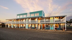 A two-story building with a balcony and multiple windows, labeled "Sand Dollar." - Sand Dollar Condos (Pacific Beach)