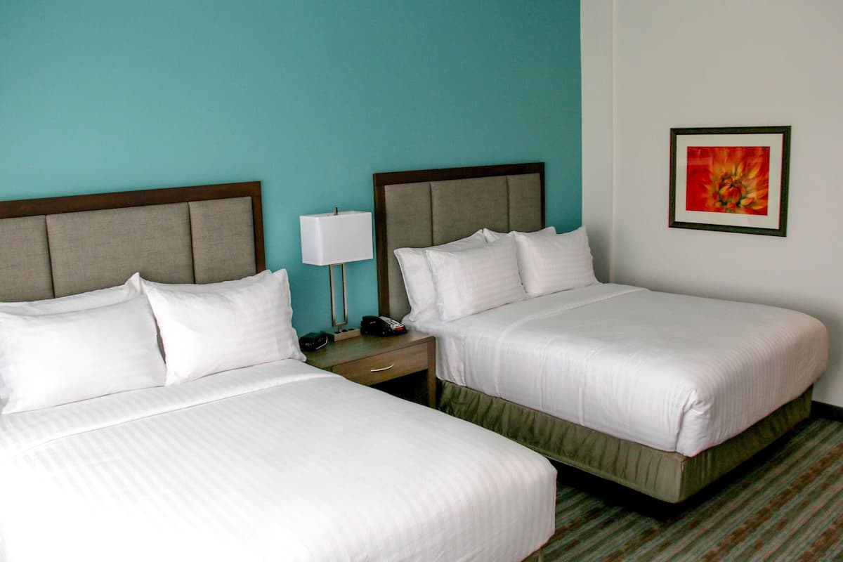 Premium bedding, pillow-top beds, desk, laptop workspace