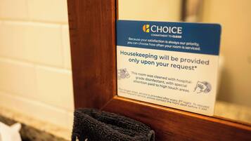 A sign indicating housekeeping services are available upon request, with a focus on cleanliness and attention to high-touch areas.