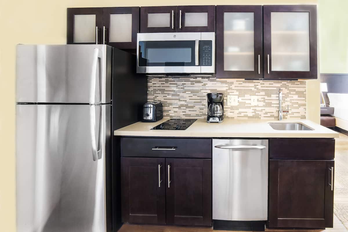 full-sized fridge, microwave, stovetop, dishwasher