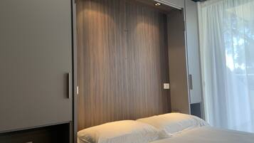 Design Apartment | Premium bedding, down duvets, in-room safe, blackout curtains