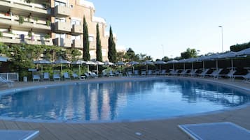 Outdoor pool, open 10:00 AM to 7:00 PM, pool umbrellas, pool loungers