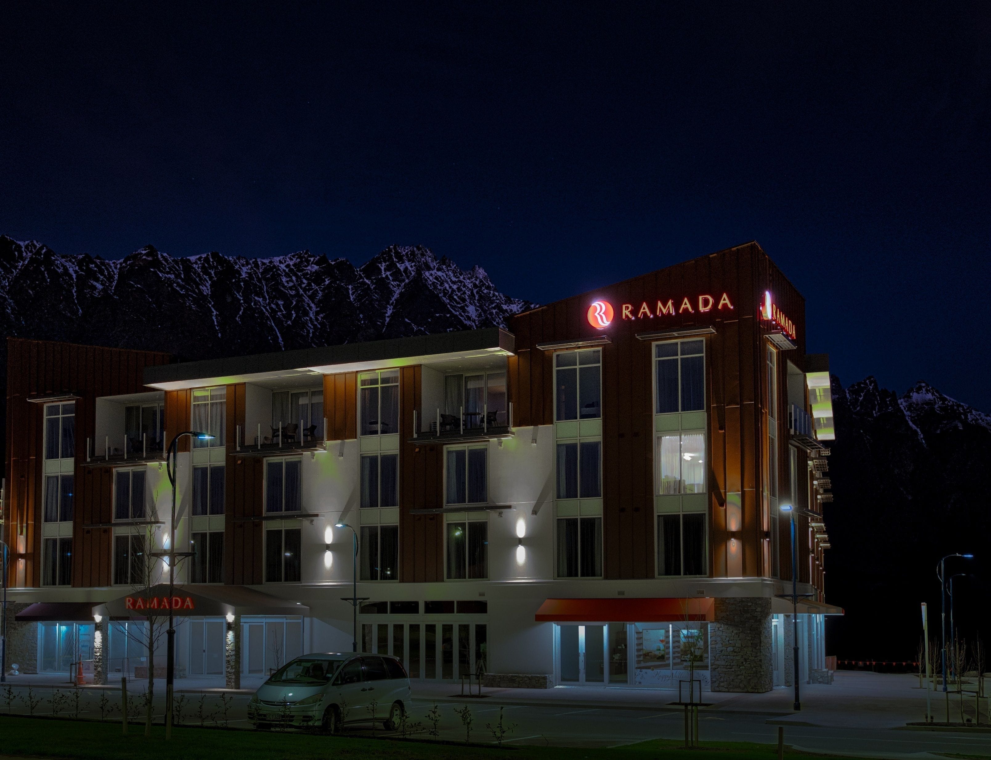 A modern building with the name "RAMADA" prominently displayed on the facade.