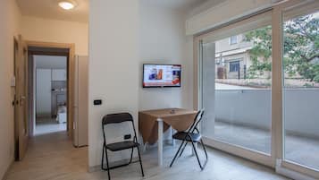 Suite, 1 camera da letto | Area soggiorno | TV a schermo piatto