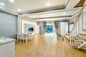 45 villa | Living area | 45-inch flat-screen TV with cable channels, TV, heated floors - Water Garden Resort (Jeju City)
