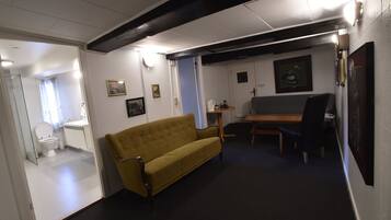 Economy Double Room, Shared Bathroom | Living area | 40-inch flat-screen TV with cable channels, TV