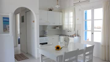 Apartment, 2 Bedrooms, Sea View | Private kitchen | Fridge, stovetop, electric kettle, cookware/dishes/utensils