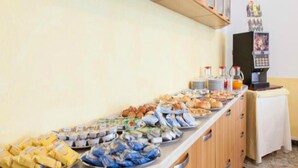 A buffet with various food items and a coffee machine. - Hotel Ronconi (Rimini)