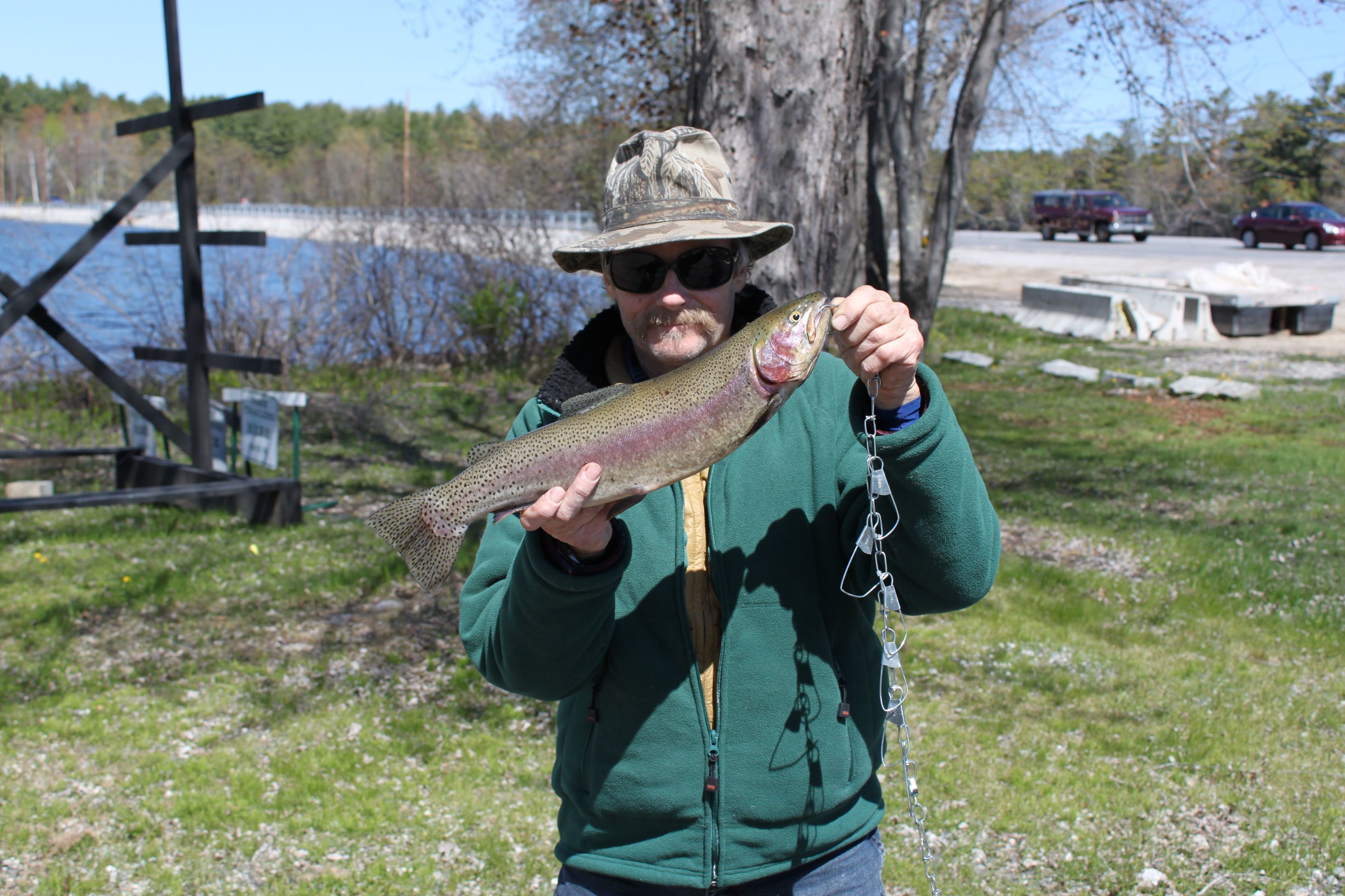 A person holding a fish.