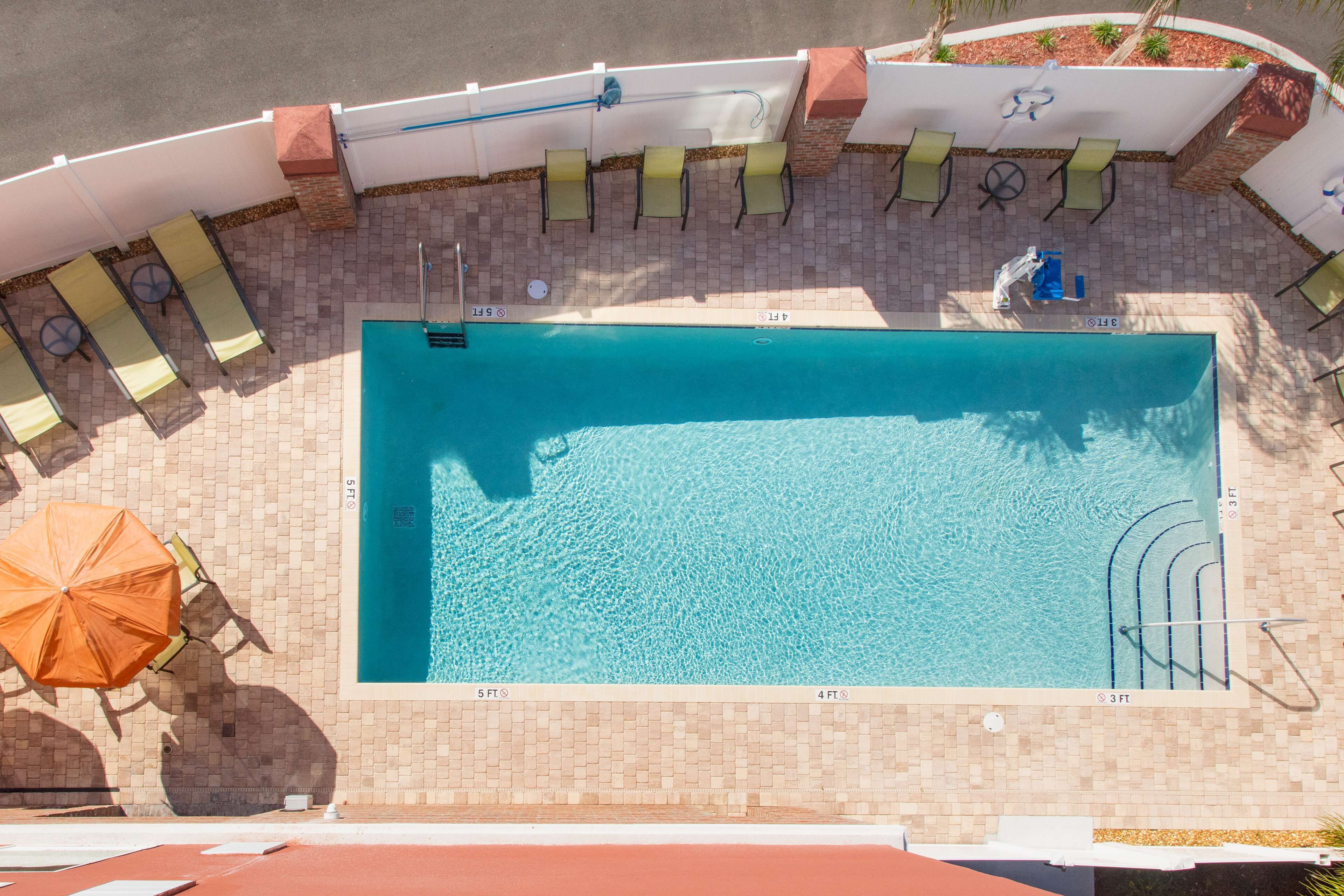 outdoor pool, pool umbrellas, pool loungers