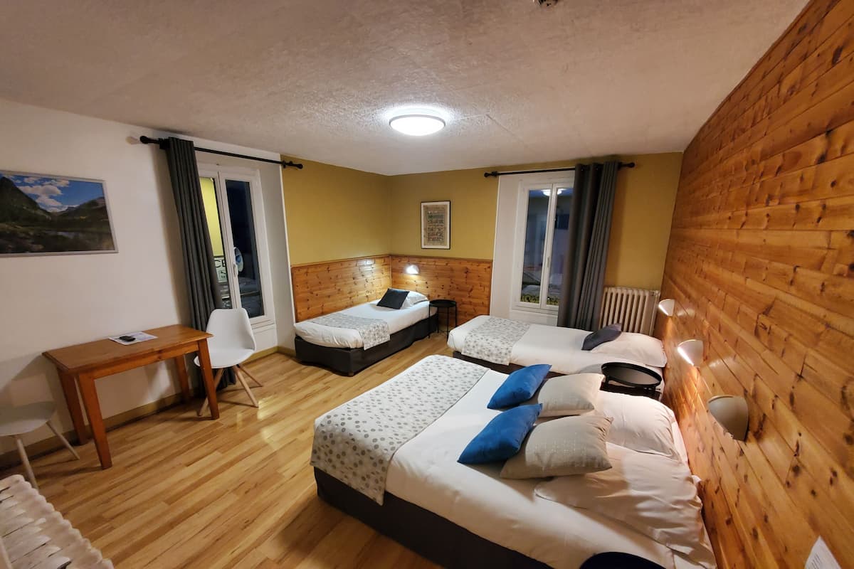 Standard Quadruple Room | In-room safe, individually decorated, desk, soundproofing