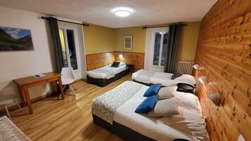 Standard Quadruple Room | In-room safe, individually decorated, desk, soundproofing