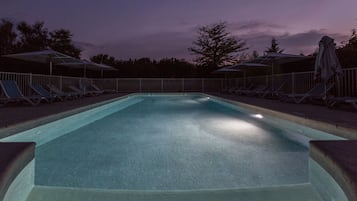 Seasonal outdoor pool, open 7:00 AM to 10:00 PM, pool umbrellas