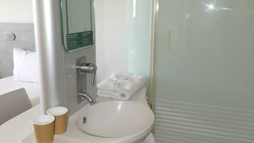 Shower, eco-friendly toiletries, hair dryer, towels