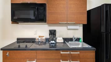 Full-size fridge, microwave, stovetop, coffee/tea maker