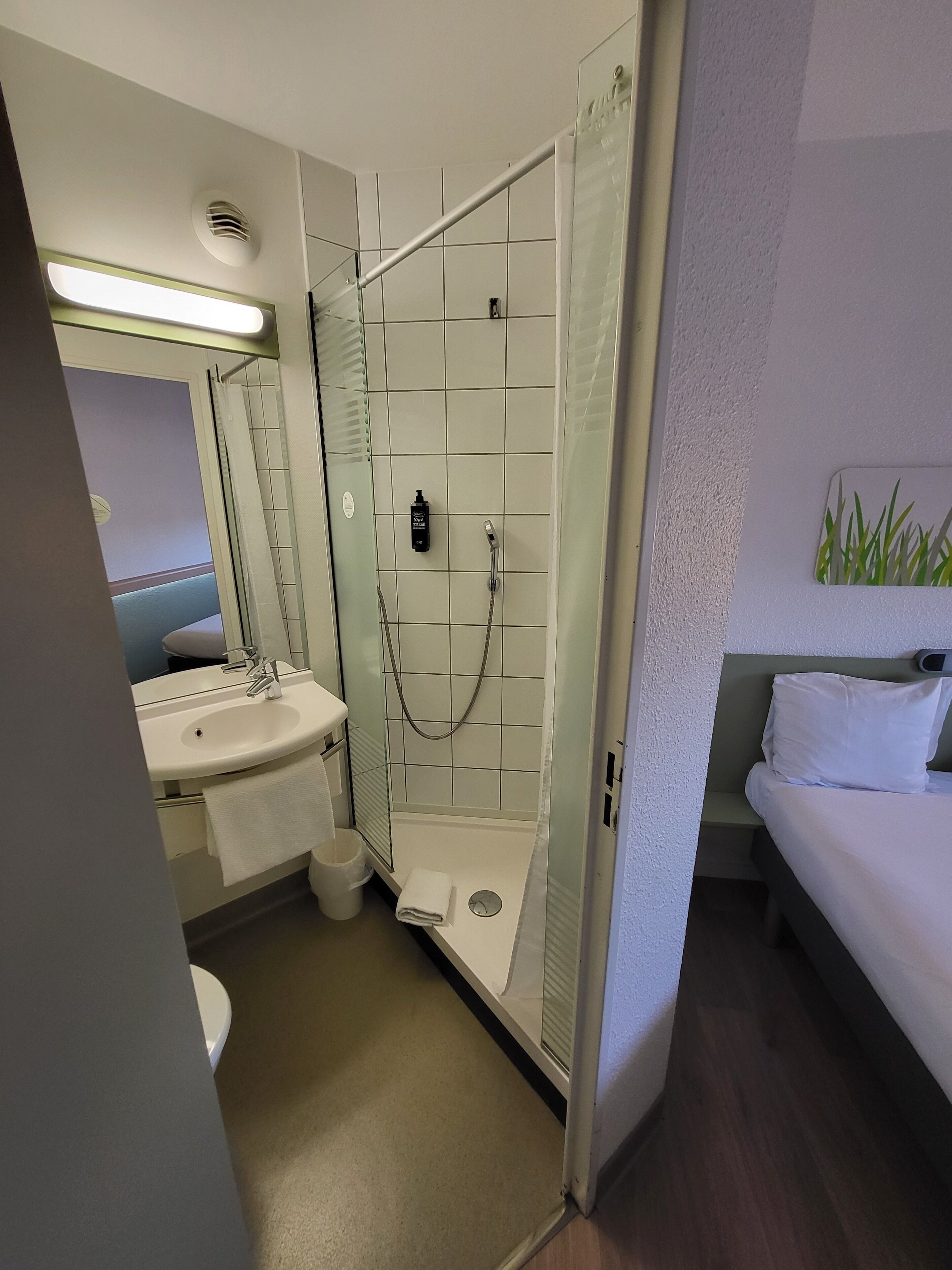 Shower, eco-friendly toiletries, hair dryer, towels