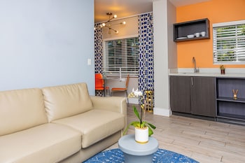 Queen Studio | Living area | 42-inch plasma TV with cable channels, TV at Oceanside Hotel and Suites