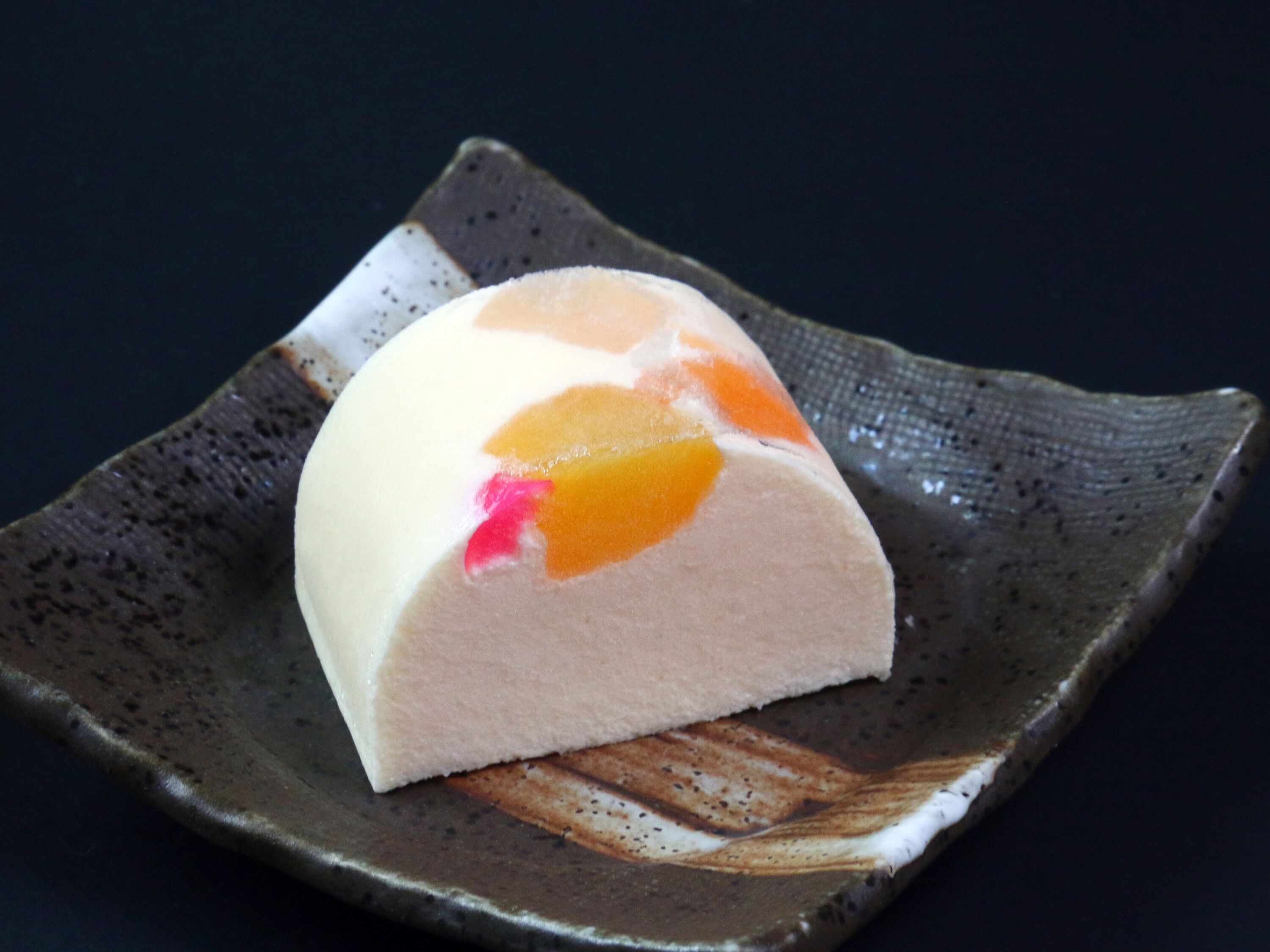 A dessert on a ceramic plate.
