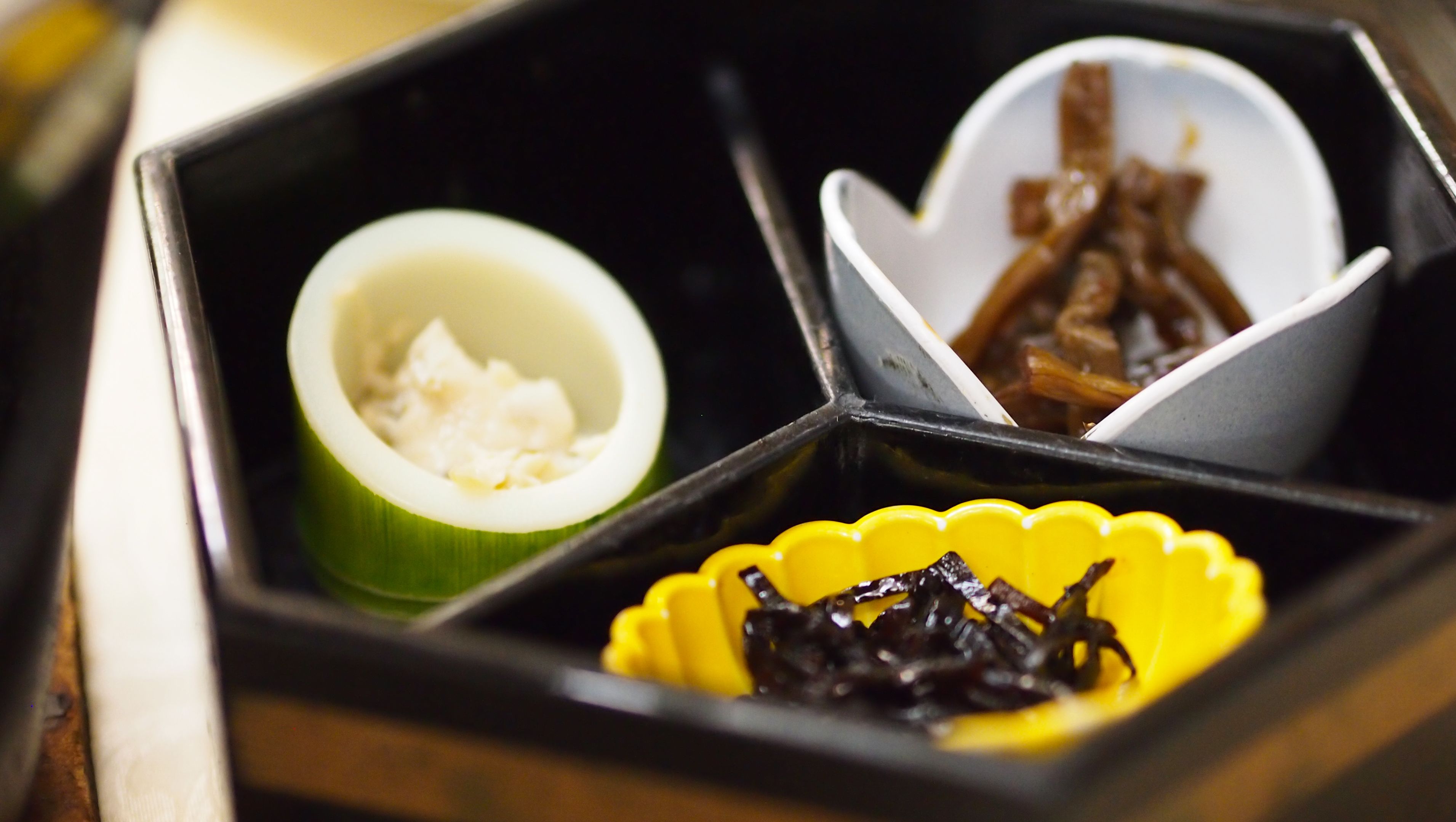 A meal divided into three sections with different food items.