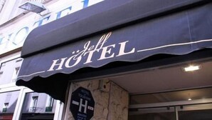 A hotel sign with the name "Jeff & Hotel" in a classic font.