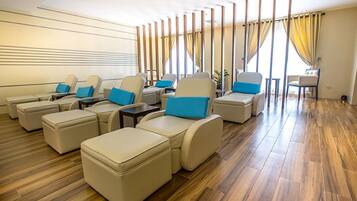 Relax in a comfortable lounge area with sofas and armchairs, perfect for conversation.
