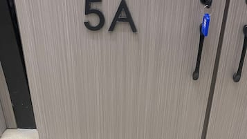 A grey cabinet with the label "5A" and a keyhole with a blue keychain.